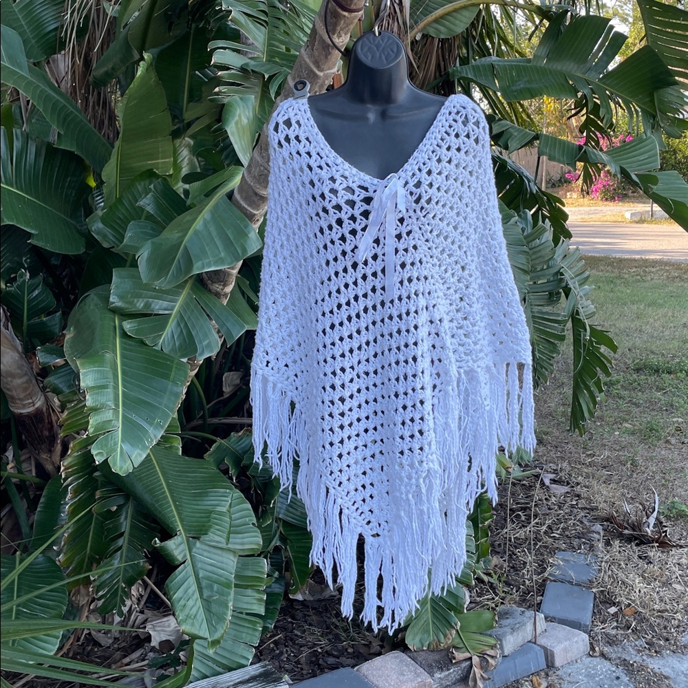 handcrafted, crochet fringe poncho with a bow